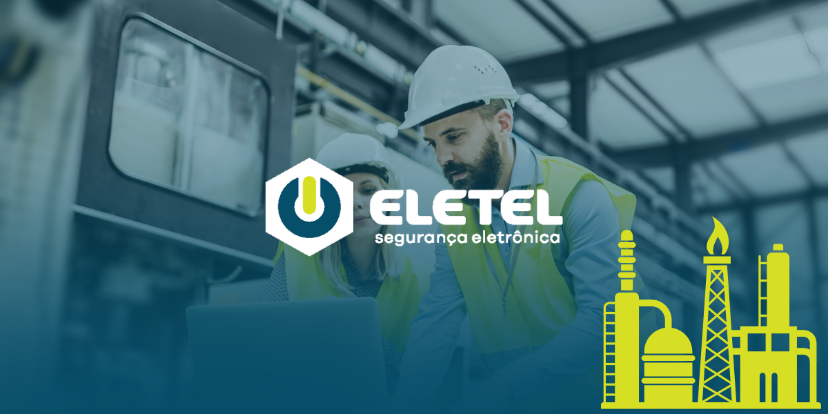 Profissionais da indústria analisando projeto de segurança eletrônica com foco em soluções personalizadas da Eletel Segurança Eletrônica.